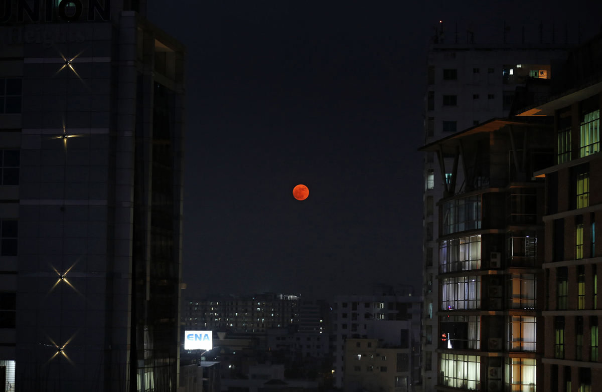 The moon rises above Dhaka, Bangladesh, Monday, Nov. 14, 2016. The brightest moon in almost 69 years will be lighting up the sky this week in a treat for star watchers around the globe. The phenomenon known as the supermoon will reach its most luminescent in North America before dawn on Monday. (AP Photo/ A.M. Ahad)