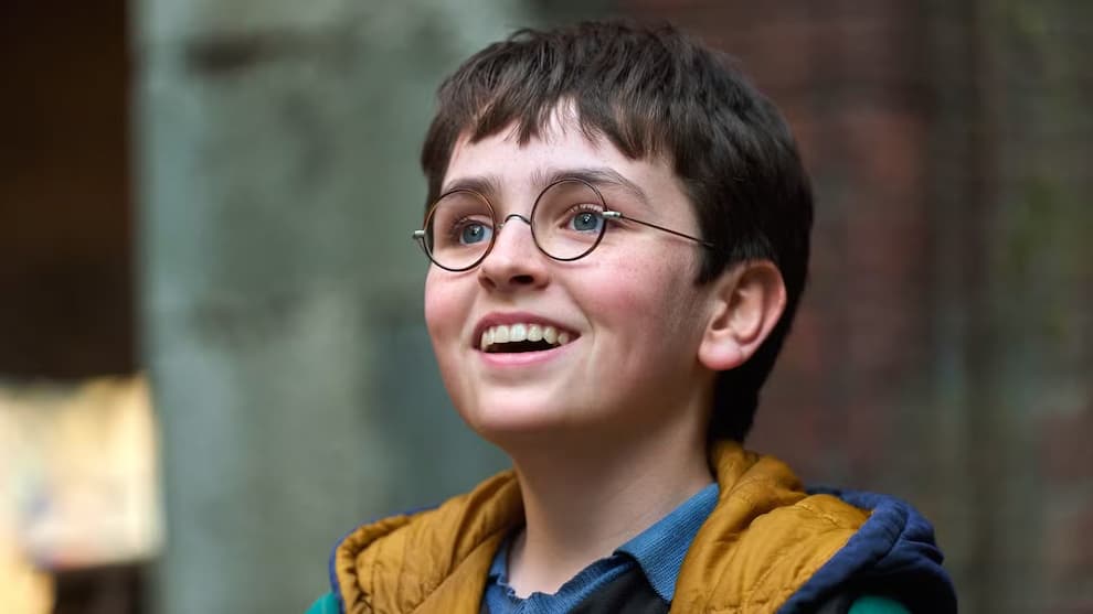 dominic-mclaughlin-smiling-as-harry-potter-in-harry-potter-and-the-philosopher-s-stone