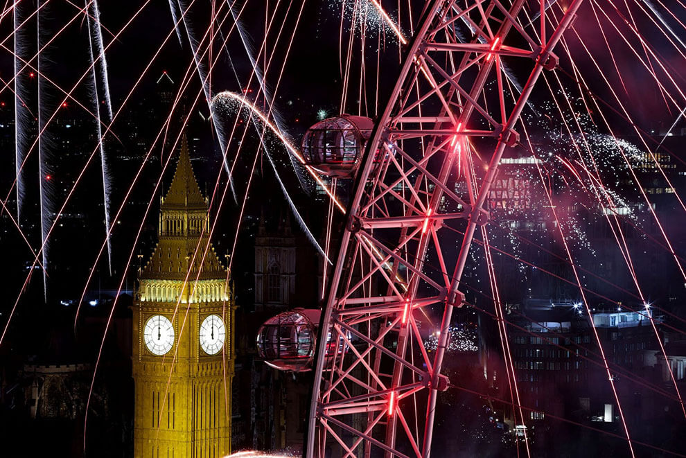 A view of fireworks over the Big Ben and London Eye to mark the New Year's celebrations, in London. REUTERS/Hollie Adams