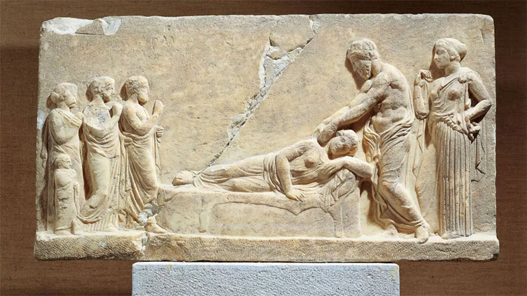 This marble relief shows Hippocrates (or potentially Asclepius, the god of medicine) treating a sick woman. (Image credit: DEA / G. DAGLI ORTI / Contributor via Getty Images)