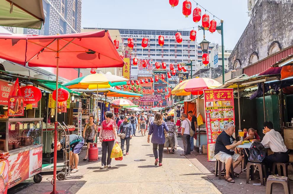 Shops and food stalls pack Petaling St in Kuala Lumpur's Chinatown. Getty Images